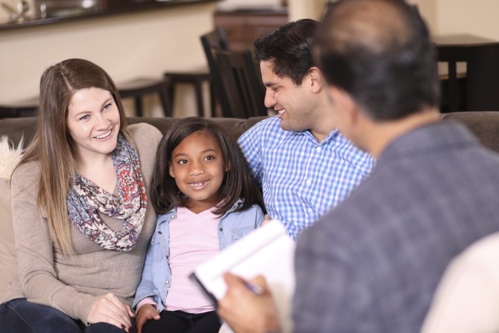 A foster family attends counseling with their foster child